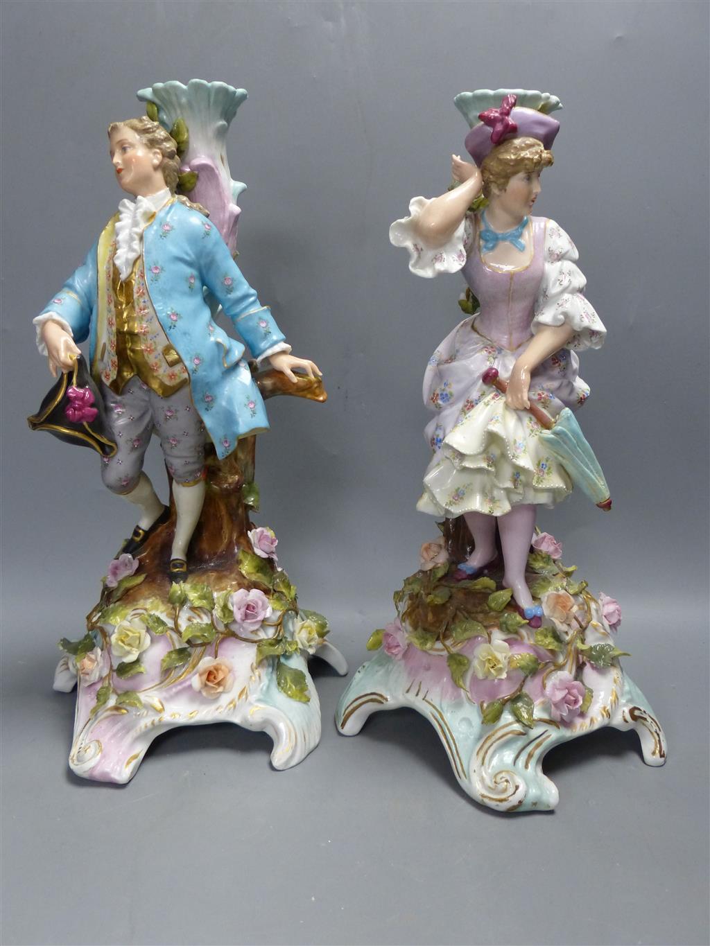 A pair of early 20th century Plaue porcelain figural candelabra, overall height 48cm